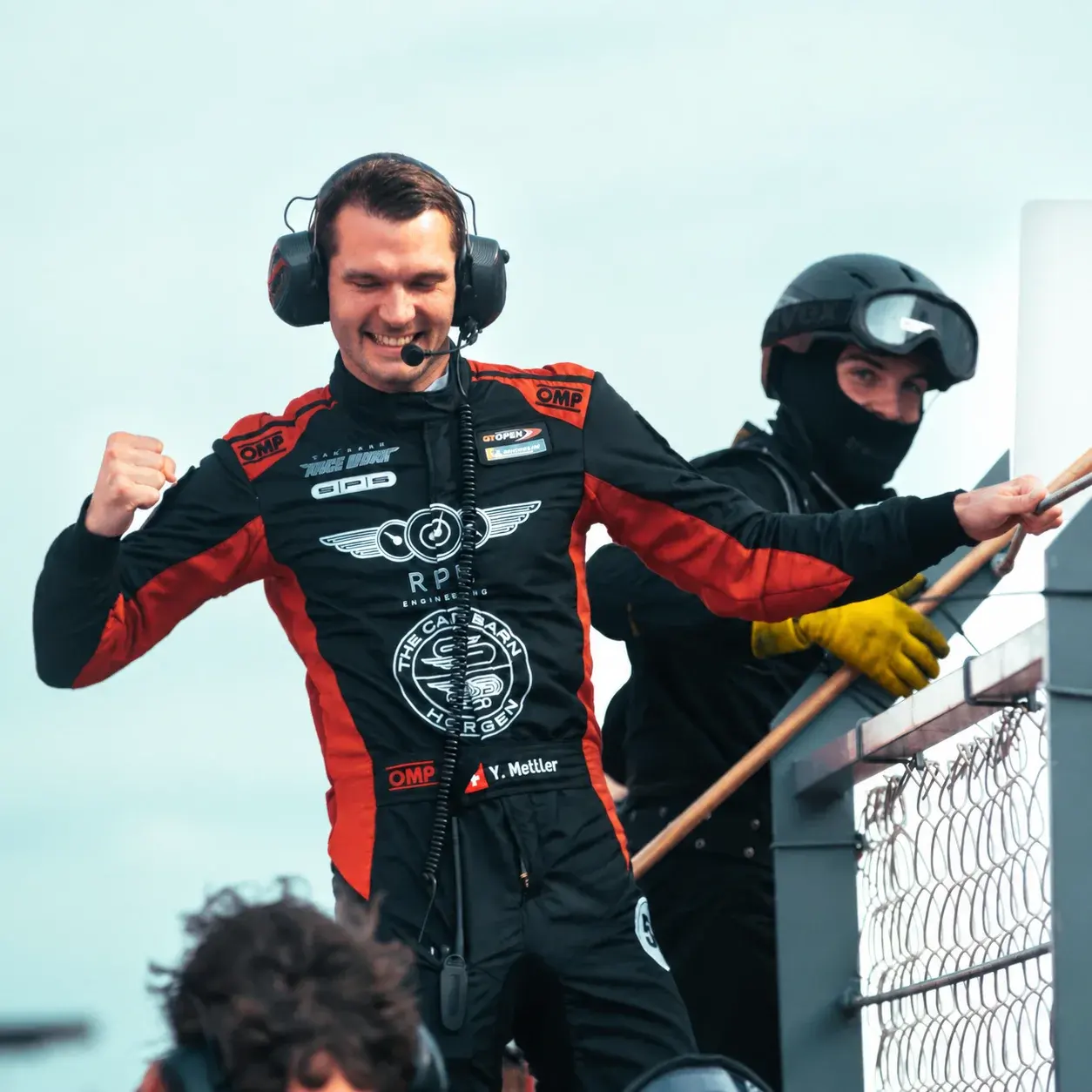 Celebrating a client's win from the pit wall
