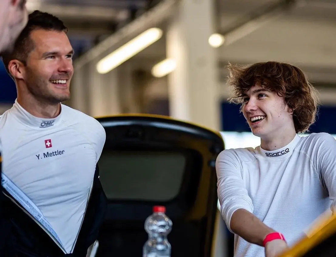Trackside debrief with a young driver