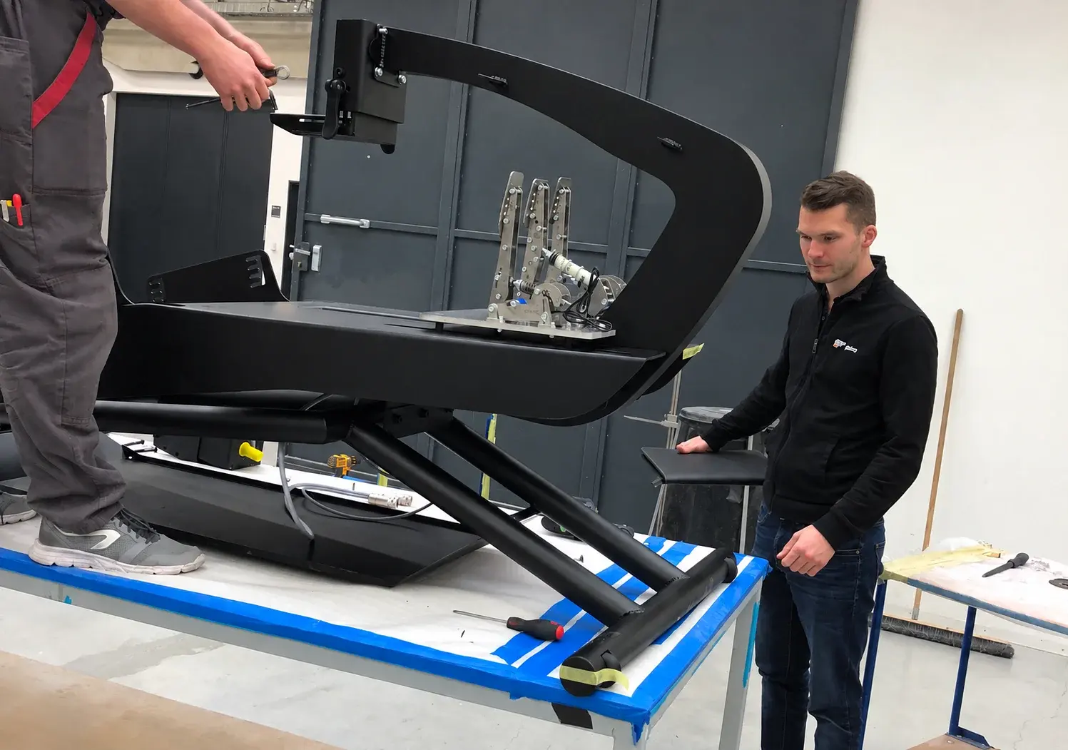 Checking a simulator cockpit during assembly in the workshop