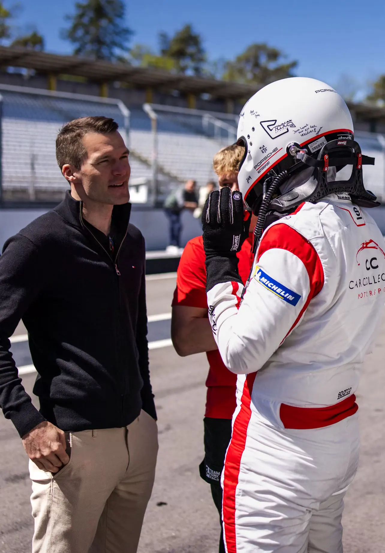 Briefing a driver in the pit lane before a run