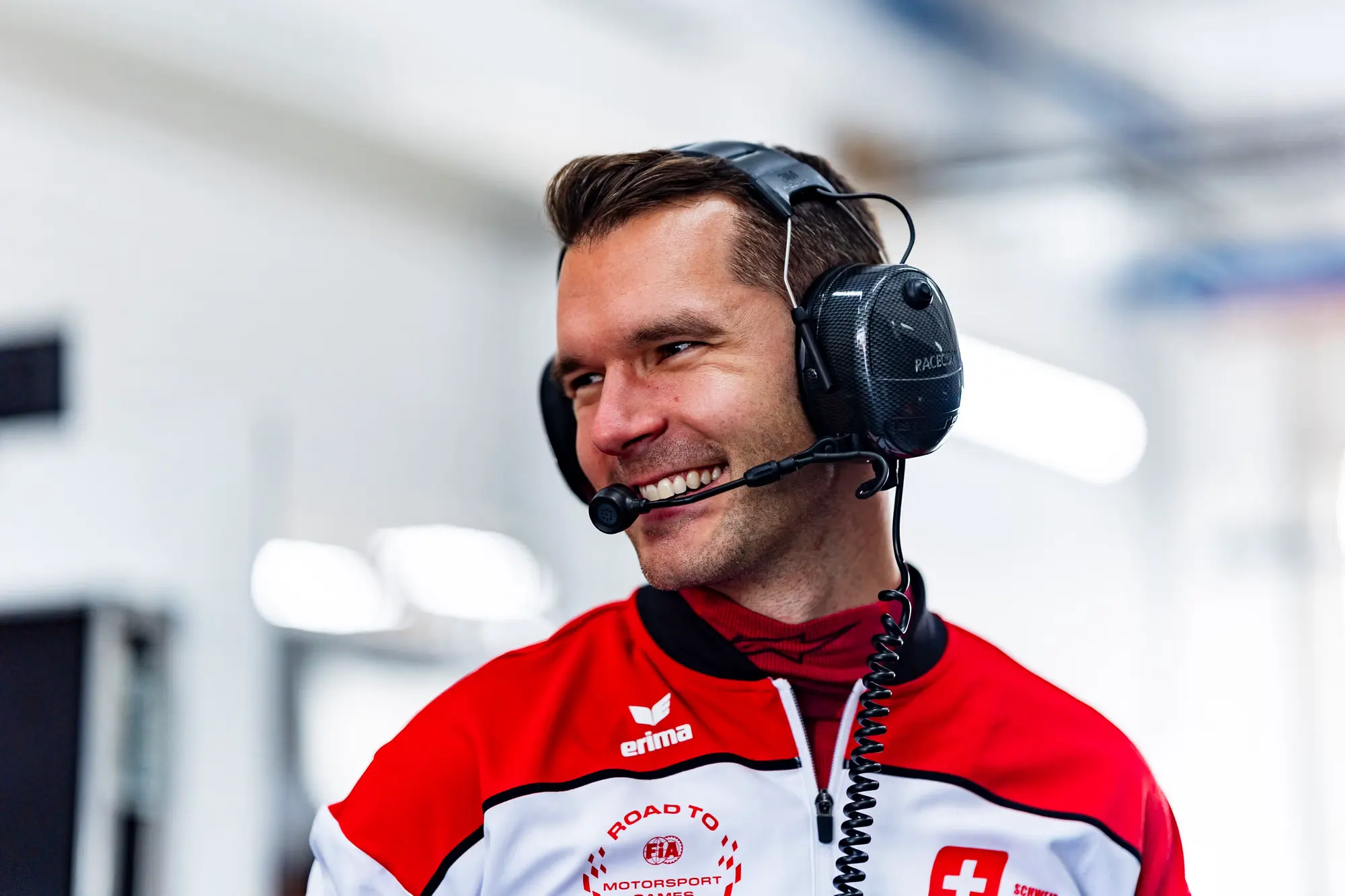 On the pit wall with headset between runs