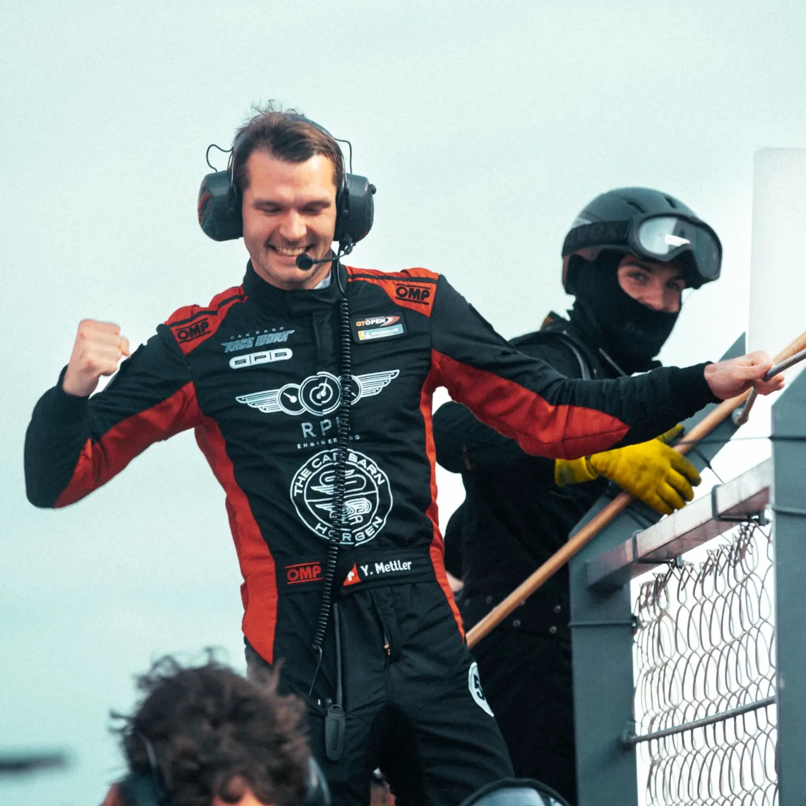Celebrating a client's win from the pit wall